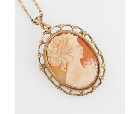 A hallmarked 9ct yellow gold framed cameo pendant/brooch, on an unmarked yellow metal curb link chain.