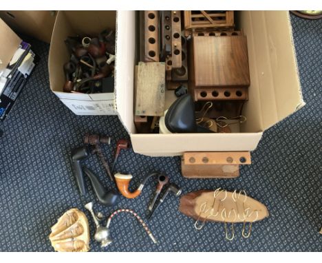 A selection of pipes together with various pipe stands.