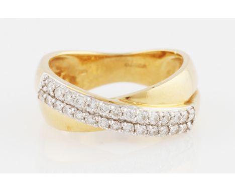 An 18ct yellow gold diamond ring, the cross over design featuring two rows of round brilliant cut diamonds, hallmarked London