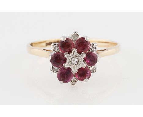 A ruby and diamond flower design cluster ring, hallmark indistinct, ring size R.