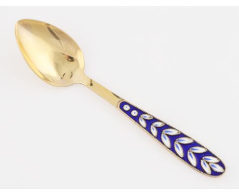 A Russian silver gilt enamel spoon.