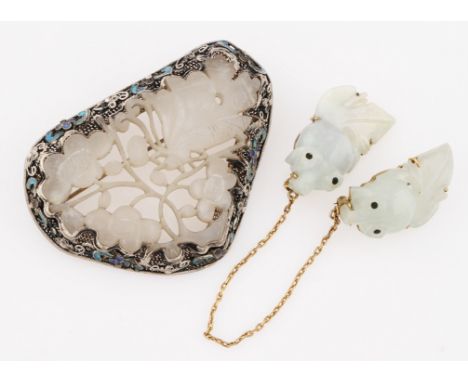 A carved white jade brooch with white metal frame featuring enamel decoration, stamped SILVER, together with a linked pair of