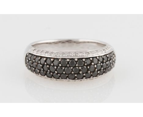 A colourless and black diamond ring, half band set with three central rows of round brilliant cut diamonds, flanked to either
