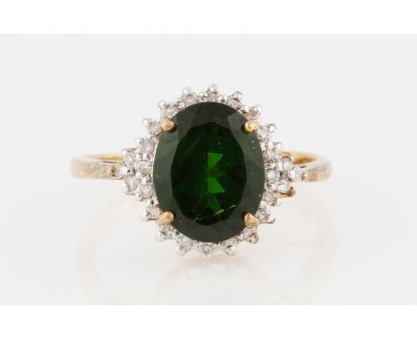 A 9ct yellow gold chrome diopside and diamond cluster ring, set with an oval chrome diopside surrounded by diamond accents, h