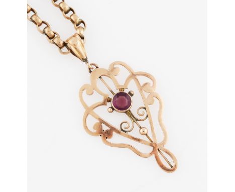 An Edwardian purple paste pendant, the open metalwork design set with a central round cut purple paste, stamped 9ct, on a bel