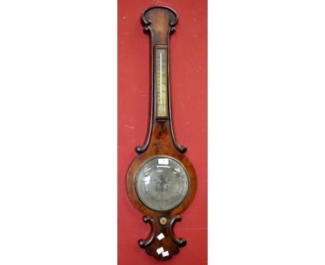 A mid-19th century mahogany wheel barometer onion top, silvered dial and thermometer.