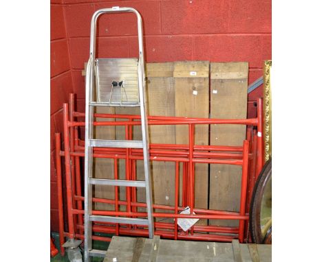 A mobile scaffold tower; an aluminium ladder; an acrow prop (3)
