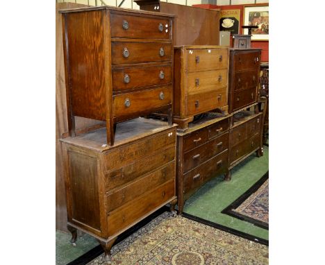 An Art Deco oak three drawer dressing table base; conforming three drawer chest; four other 1930/40's chests of drawers (6)