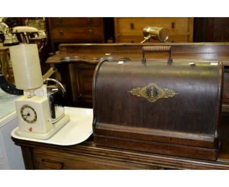 A Vintage Art Deco Goblin Teasmade lamp on tray;  a singer hand operated sewing machine, cased (2)