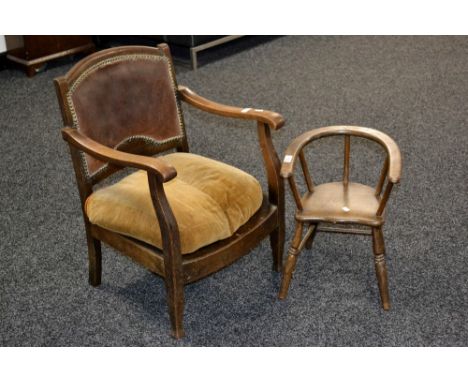 An early 20th century oak and leather tub chair, squab cushion; a child's chair (2) 
