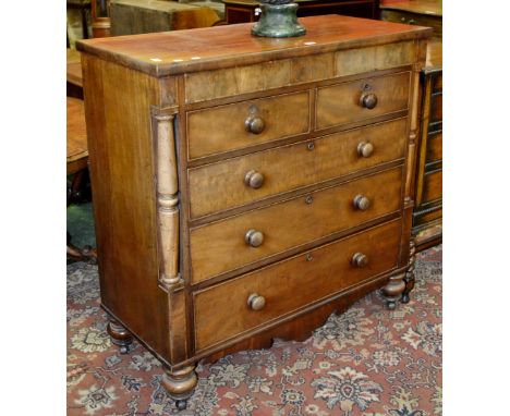 A Victorian mahogany chest of drawers, oversailing top, two hidden drawers to walnut veneered frieze, two short cockbeaded dr