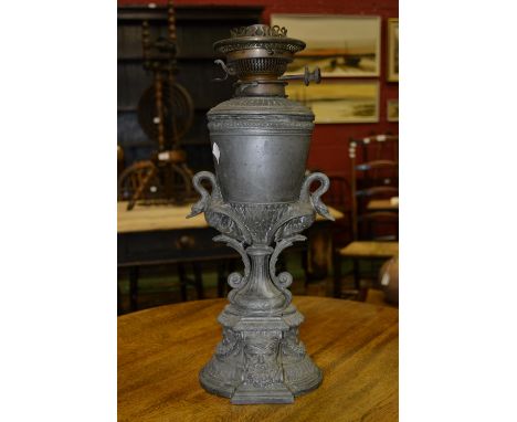A Victorian oil lamp, circular reservoir, gadrooned edge, swags to base, c.1890