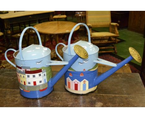 Two vintage galvanized watering cans decorated with hand painted enamel Devon coastal scenes, painted by R. Harrison.