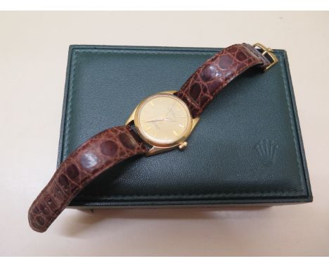 A good 1952 18ct yellow gold Gentleman's Rolex Oyster Perpetual wristwatch on a crocodile strap with plated buckle, model 100