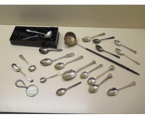 A collection of assorted silver spoons, a ladle, and magnifying glass, total silver wight approx 8.8 troy oz 