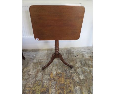 A 19th century tilt top wine table on turned column and tripod legs, 70cm tall x 61cm x 43cm, in good polished condition 