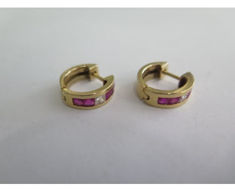 A pair of yellow gold ruby and diamond earrings, 15mm wide, tests to approx 18ct, approx 6.6 grams, in good condition 