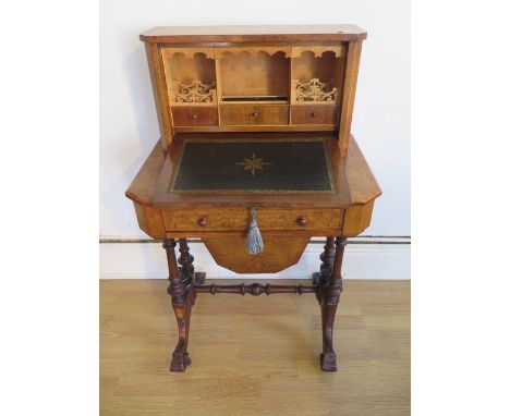 A good Victorian burr walnut inlaid bonheur de jour worktable with a fall front enclosing a fitted correspondence interior ov