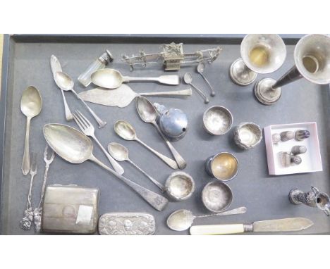 An assortment of silver and white metal items including flatware, salts, cigarette case, Chinese sedan chair, thimbles etc. t