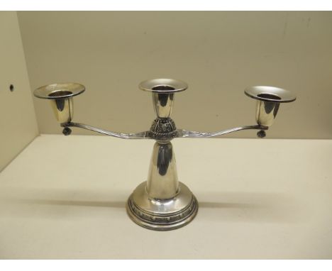 An Irish silver Celtic design candlestick, Dublin 1967, with weighted base, 15cm tall x 26cm wide, in good condition 