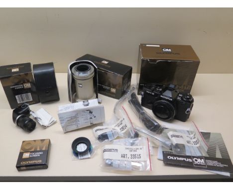 An Olympus OM-4Ti Olympus SLR camera body with a Varimagni Finder OM system and a OM-Mount Photomicro adapter L, and focusing