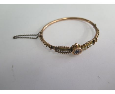 A 9ct yellow gold pearl bangle, 6.5cm x 5.8cm external, approx 8.2 grams 