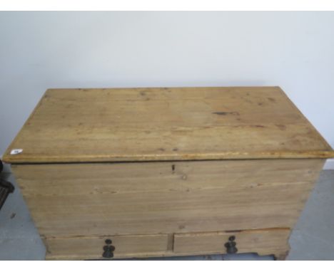 A Georgian stripped pine two drawer mule chest with an interesting papered interior and secret drawers , 69cm tall x 110cm x 