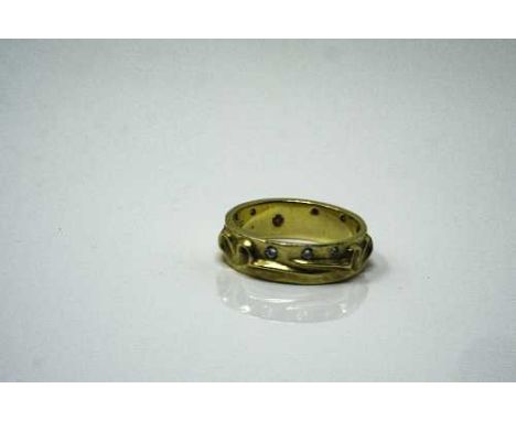 An 18ct yellow gold and diamond ring by Boodles and Dunthorne, 7.2g, approximately 0.2ct, size O.