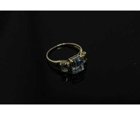 A  10ct gold blue topaz and diamond set ring, size O.