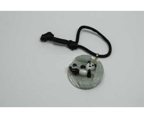 A yellow gold mounted jade 'panda' pendant, diameter 38 mm.