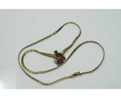 An 18ct gold ruby and diamond necklace, 12.45g.