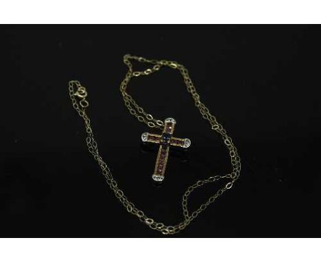 A 10ct yellow gold sapphire, ruby and diamond cross pendant on chain, pendant weight 1.9g, diamond weight approximately 0.08c