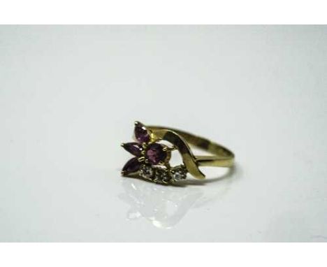 An 18ct gold ruby and diamond ring, size P/Q.