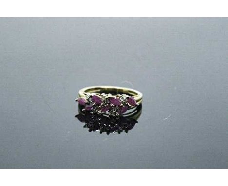 A 10ct gold ruby and diamond ring, approximately 0.9ct rubies, size N.
