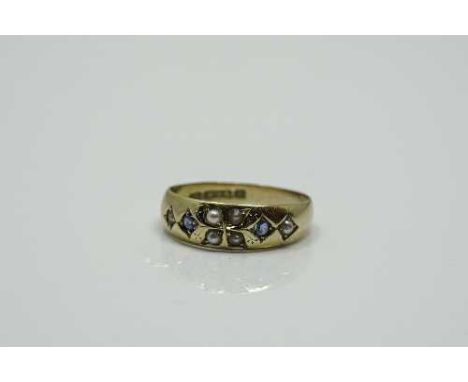 A 15ct gold sapphire and pearl ring, size K.