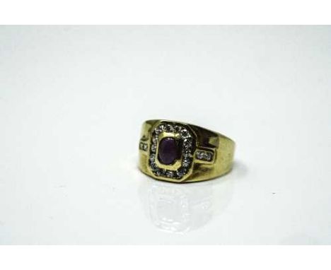 An 18ct yellow gold cabochon ruby and diamond set ring, size O.