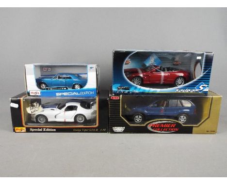 Maisto, Motor Max, Solido - Four boxed diecast vehicles in 1:18 and 1:24 scale. Lot consists of Maisto Special Edition 1966 C