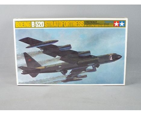 Tamiya - A boxed 1/100 scale Tamiya Boeing B52D Stratofortress plastic model kit. The kit is in factory sealed clear cellopha