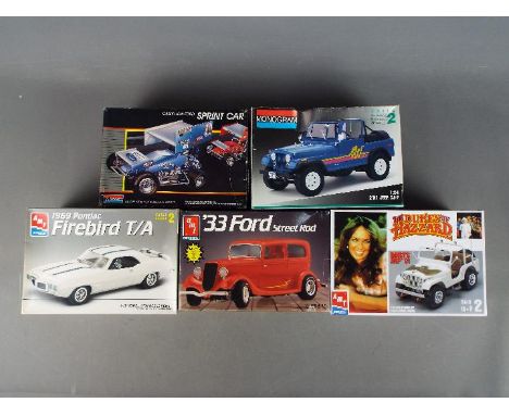Monogram, AMT - Five boxed plastic model car kits in various scales. Lot includes AMT 1::25 'The Dukes of Hazzard' Daisy Duke
