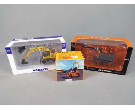 NZG, Universal Hobbies - Three boxed diecast 1:50 scale diecast construction vehicles. Lot consists of NZG #715 Hamm HD 12 VV