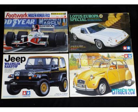 Footwork, Tamiya - Four boxed plastic model vehicle kits in various scales. Lot consists of Footwork Modelers1:20  Mugen Hond