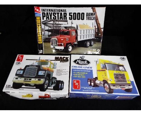 AMT, AMT ERTL - Three boxed 1:25 scale model kits of trucks to include # 31007 International Paystar 5000 Dump Truck, # 38682