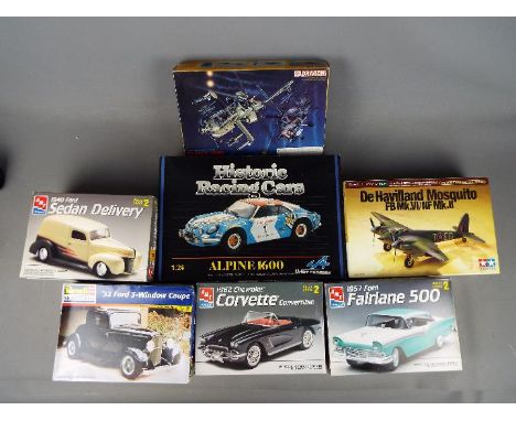 Tamiya, Heller Revell, AMT , Dragon - Seven boxed plastic model kits in various scales. Lot includes AMT 1:25 1940 Ford Sedan
