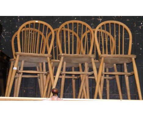 A set of six stick back chairs