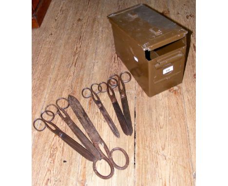 Antique scissors in ammunition case