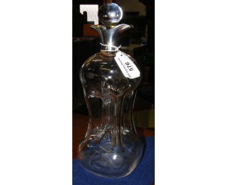 A silver top decanter