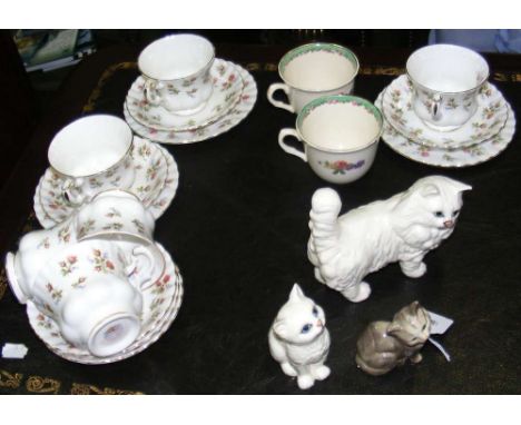Three Beswick cat ornaments, Clarice Cliff cups, etc.