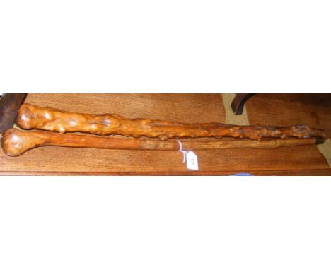 An old wooden walking stick and one other