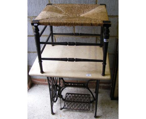 Marble top garden table with Singer sewing machine wrought iron base, together with a rush seated stool