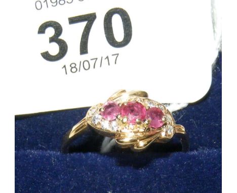 Ruby and diamond cluster ring in 9ct gold setting